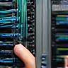 Technician configuring network cables